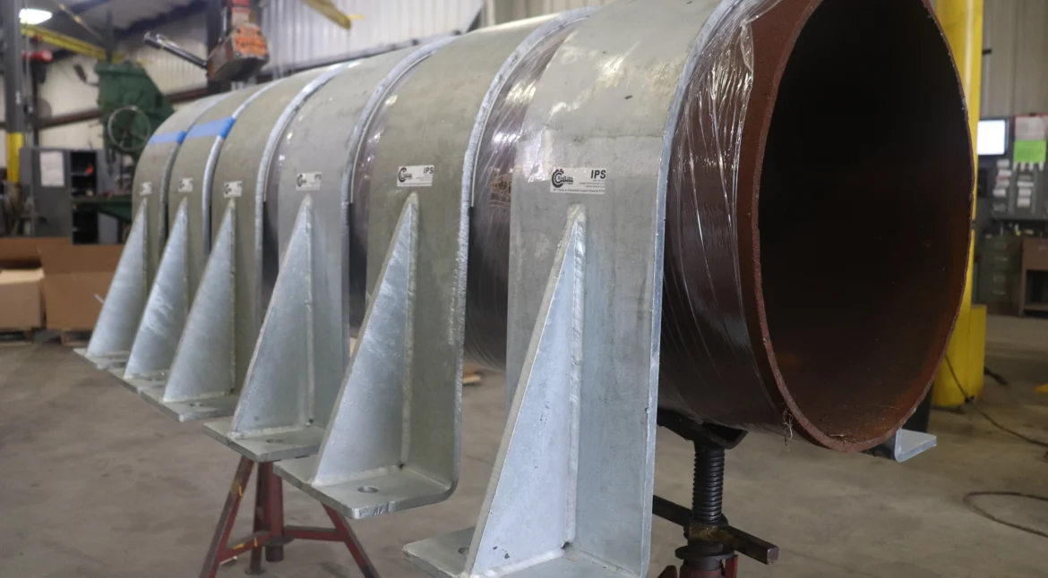 30-inch RedLineIPS hold-down clamps on a large pipe during the production phase.