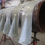 30-inch RedLineIPS hold-down clamps on a large pipe during the production phase.