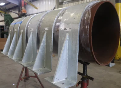 30-inch RedLineIPS hold-down clamps on a large pipe during the production phase.