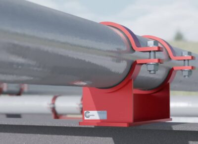 A RedLineIPS weldless pipe shoe securely holds a pipe in place with bolted clamps, providing a robust and corrosion-resistant support solution.