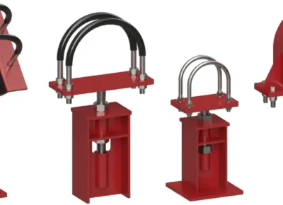 Hero Image - Variety of RedLineIPS Adjustable Pipe Supports Lineup of eight RedLineIPS red adjustable pipe supports from Cogbill Construction, showing different tops including saddles, U-bolt clamps, wear-pad cradles, heavy pipe clamps, and an elbow stand for refinery and petrochemical piping.
